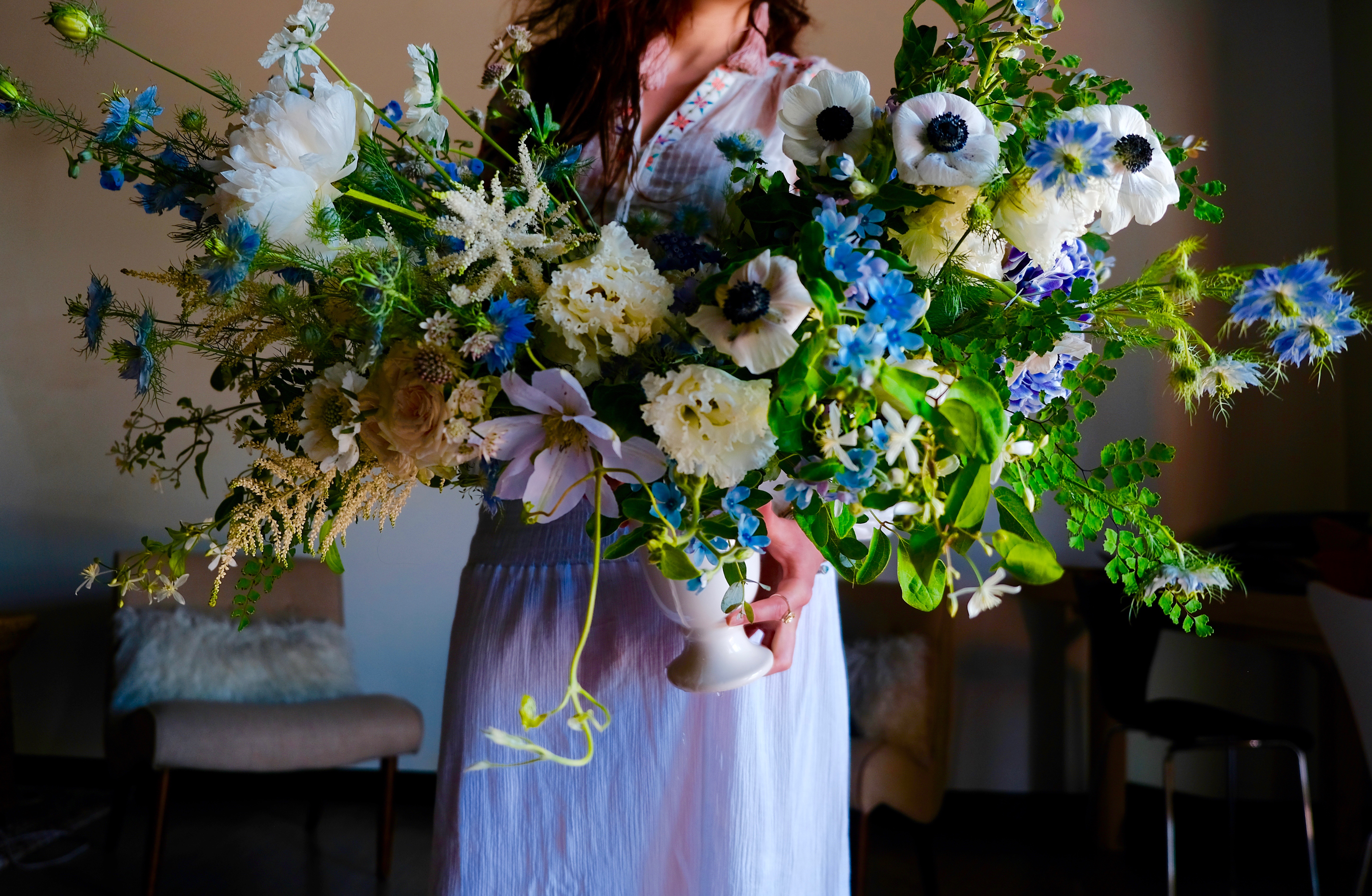 Garden style arrangement with blue flowers